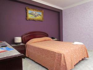 Ένα ή περισσότερα κρεβάτια σε δωμάτιο στο Hotel Lisboa