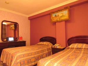 Кровать или кровати в номере Hotel Lisboa