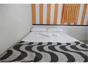 Postel nebo postele na pokoji v ubytování Hotel Rio de Pedras