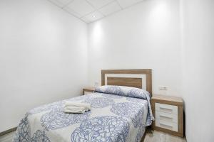 Łóżko lub łóżka w pokoju w obiekcie Apartamento Venus 1