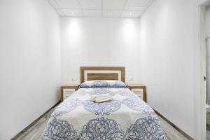 Łóżko lub łóżka w pokoju w obiekcie Apartamento Venus 1