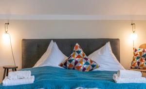 A bed or beds in a room at Bergvilla Oberon