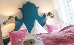 A bed or beds in a room at Bergvilla Oberon