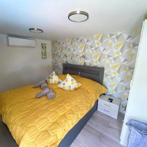 A bed or beds in a room at Lacus Pelso Holiday Home