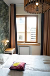 Postel nebo postele na pokoji v ubytování Hotel Finn