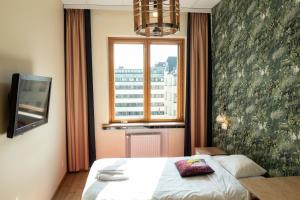 Postel nebo postele na pokoji v ubytování Hotel Finn