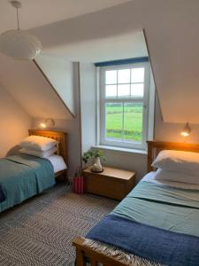Кровать или кровати в номере Arran School House - Blackwaterfoot, Isle of Arran