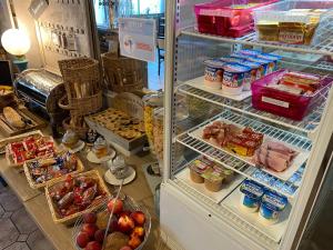 an open refrigerator filled with lots of food at Le Relax in Boulazac