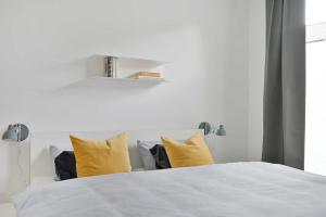 Ein Bett oder Betten in einem Zimmer der Unterkunft KOSI am Meer ACHT