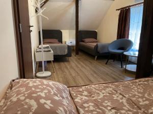A bed or beds in a room at Battonya House