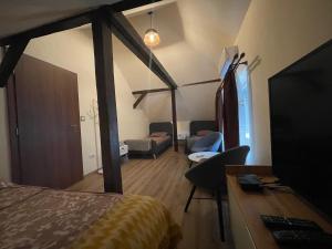 A bed or beds in a room at Battonya House