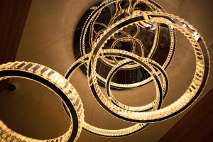 a large white chandelier hanging from a ceiling at Pinpon Hotel Hiroshima in Hiroshima