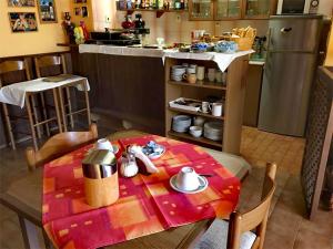 a kitchen with a table with a table cloth at Penzion U Hlaváčů in Horní Maršov