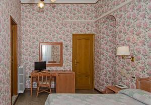 Postel nebo postele na pokoji v ubytování Hotel Villa Flores