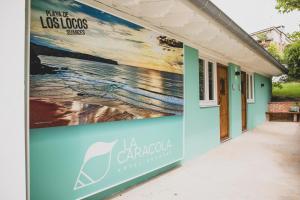 a mural on the side of a building at Hotel la Caracola Suances in Suances