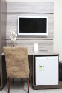 TV a/nebo společenská místnost v ubytování Hotel Real