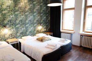 Postel nebo postele na pokoji v ubytování Hotel Finn