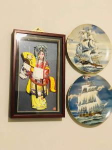 three pictures on a wall with a picture of a ship at Apple House Truganina in Truganina