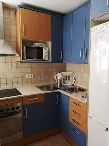 A kitchen or kitchenette at A Home in Barcelona