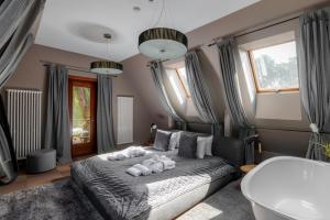 a bedroom with a bed with teddy bears on it at Boutique Apartment Villa Rumba in Kuldīga