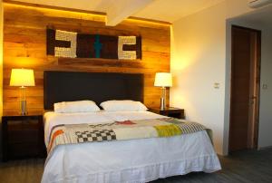 Un pat sau paturi într-o cameră la Rangi Pucon