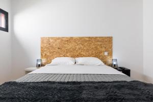 Ένα ή περισσότερα κρεβάτια σε δωμάτιο στο As Casas da Margarida