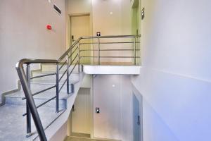 a spiral staircase in a building with a stair case at Happy Kaş Apart in Kaş