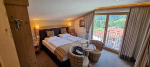 Postel nebo postele na pokoji v ubytování Hotel Bergkristall
