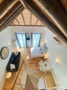 an attic room with a bed and a table at Faro Downtown Ria Formosa Studios in Faro