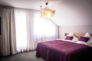 Postel nebo postele na pokoji v ubytování Hotel Restaurant Na Návsi