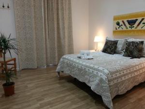 A bed or beds in a room at Casa de Huéspedes Prada