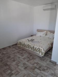 Postel nebo postele na pokoji v ubytování SunRise