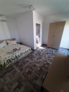 Postel nebo postele na pokoji v ubytování SunRise