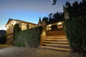 a house with stairs in front of a building at Palacio Manco Capac by Ananay Hotels in Cusco