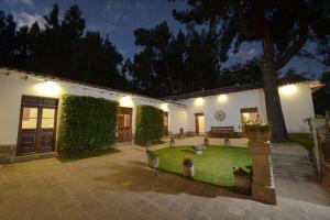 a courtyard of a house with a tree and lights at Palacio Manco Capac by Ananay Hotels in Cusco +115 photos