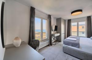 Postel nebo postele na pokoji v ubytování Liberty Living Apartments + 37 fotografií