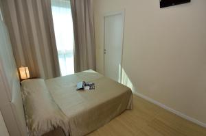 Postel nebo postele na pokoji v ubytování Hotel San Giuliano