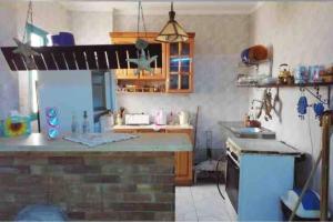 a kitchen with a counter top and a stove at Cozy Relaxed Ground Chalet with Terrace-Ras Sudr in Ras Sedr
