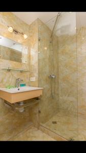 a bathroom with a sink and a shower at New Gudauri Apartment #407 in Gudauri