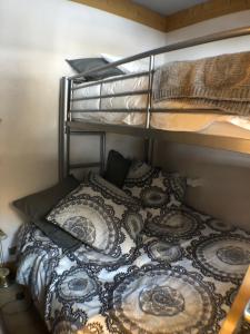 a bedroom with a bunk bed and pillows at Aiguille du Midi - Le Chamo'nid in Chamonix-Mont-Blanc
