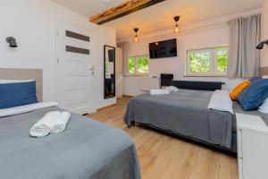 Postel nebo postele na pokoji v ubytování Hostel Szczelinka