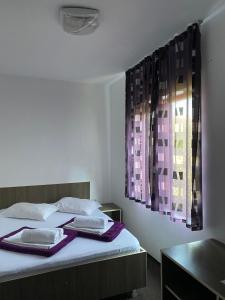 En eller flere senge i et værelse på Vila Ana Trident Costinesti