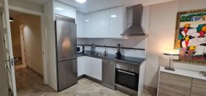 Kuchyňa alebo kuchynka v ubytovaní Puerto Fino Apartamentos