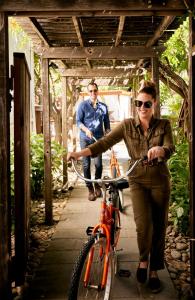 a man and a woman standing next to a bike at boon hotel + spa - adults only in Guerneville