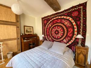 מיטה או מיטות בחדר ב-Maison Galimard