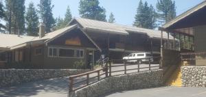 
a large stone building with a wooden roof at Holiday Haus in Mammoth Lakes
