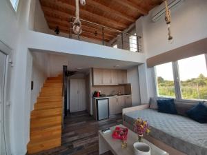 a large living room with a couch and a table at KTIMA MORAITI - Seaside Houses in Katerini
