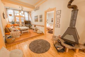 a living room with a wood stove in it at TOMOVI HOME - Three bedrooms City center in Plovdiv