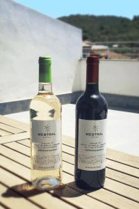 two bottles of wine sitting on a table at Hotel Mestral Perelló in Perelló