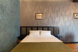 Łóżko lub łóżka w pokoju w obiekcie Irina's Apartments